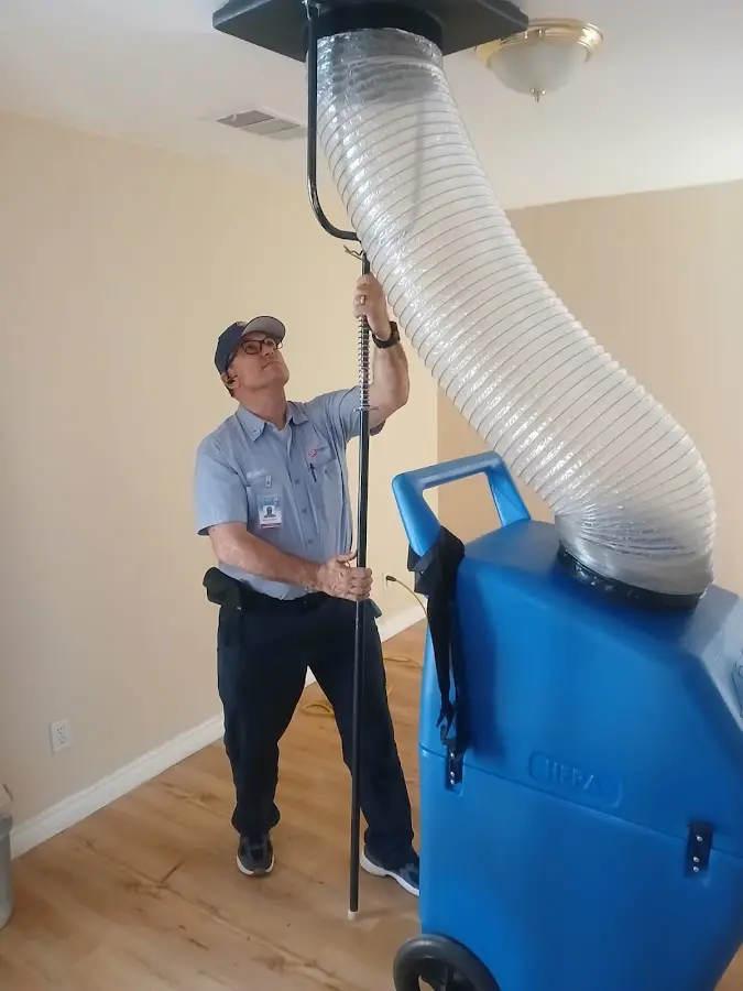 Furnace Tune-Up technician using HEPA equipment in Hyde Park